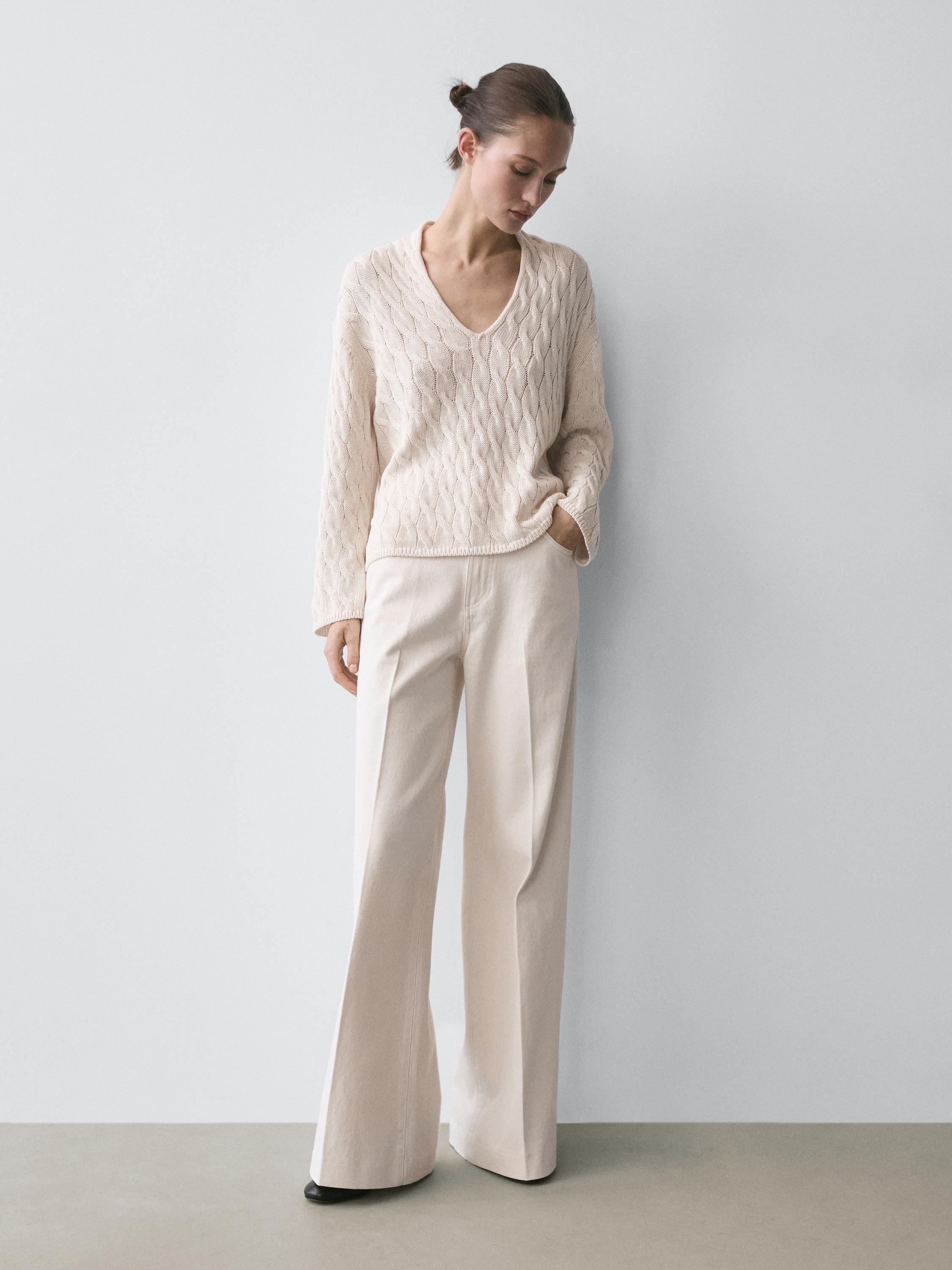 Cotton blend knit sweater with knot details